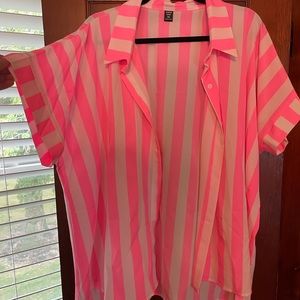 Bright pink short sleeve button down.